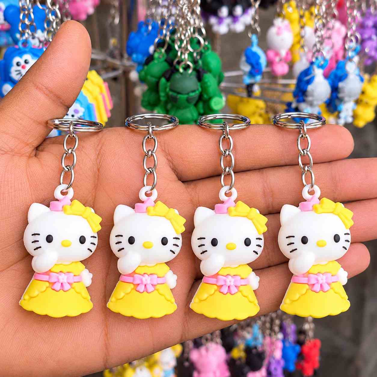 59 এক পিছ Cute Hello Kitty Yellow Dress Keychain